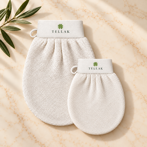 Small Tellak face mitt next to the regular Tellak mitt on cream marble